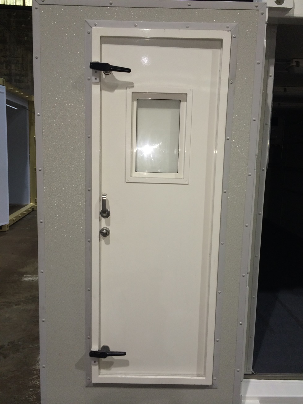 Custom Made Marine Door Installed on a Specialized Container